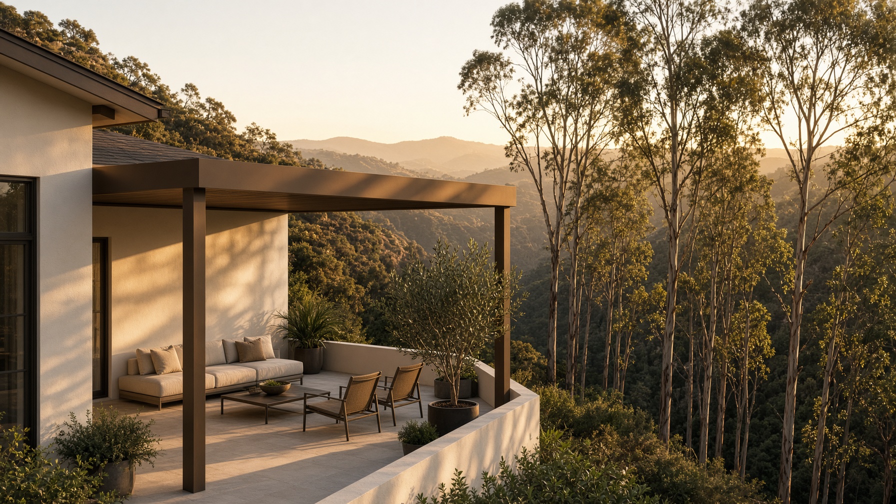 A hillside house with a patio cover overlooking a eucalyptus canyon